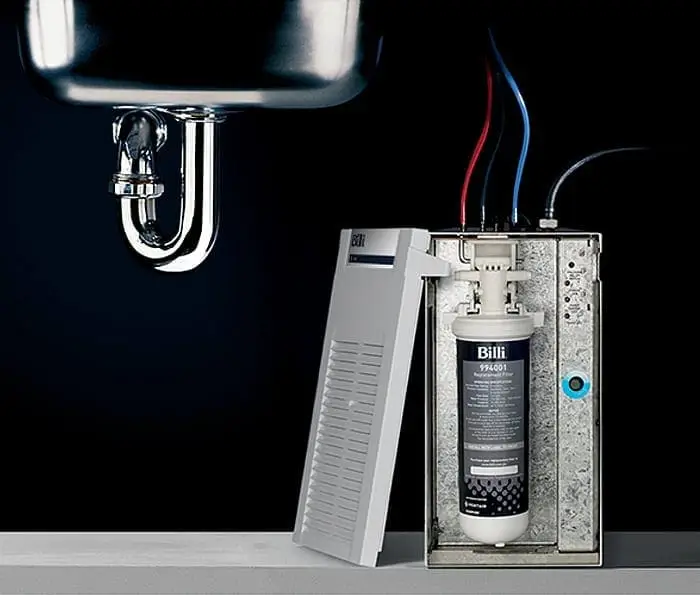 Under-bench Billi filtered water system unit open face showing replacement filter